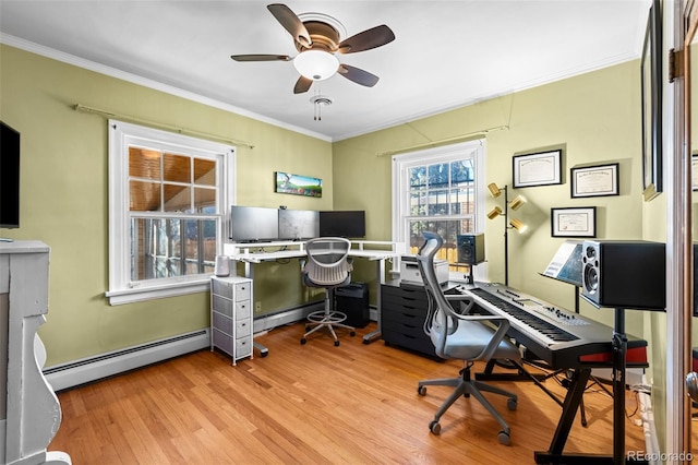 home office with a baseboard heating unit, a ceiling fan, ornamental molding, and wood finished floors