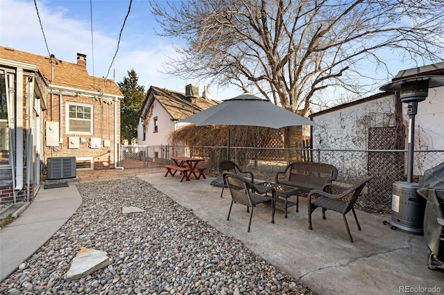 view of patio with fence, outdoor lounge area, and cooling unit