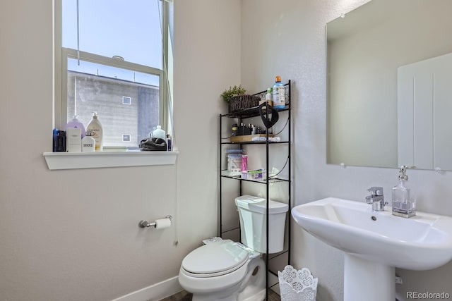 bathroom with sink and toilet