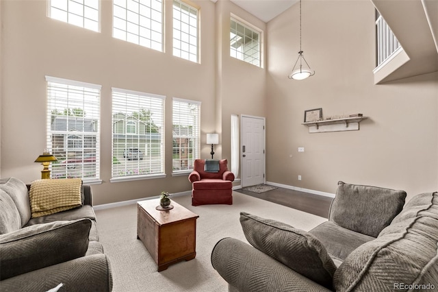 20710 E Princeton Pl, Aurora, CO 80013 - living room with a towering ceiling, healthy amount of natural light, and carpet flooring