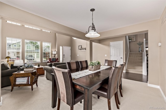 20710 E Princeton Pl, Aurora, CO 80013 - dining area featuring light carpet and stairs