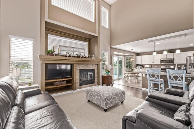 20710 E Princeton Pl, Aurora, CO 80013 - living room featuring a towering ceiling and a fireplace