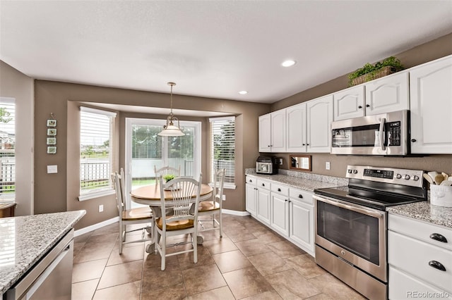 20710 E Princeton Pl, Aurora, CO 80013 - kitchen with stainless steel appliances, white cabinets, pendant lighting, recessed lighting, and light stone counters
