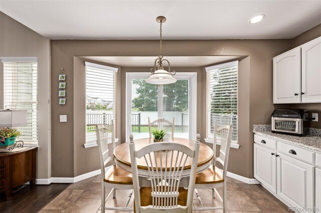 20710 E Princeton Pl, Aurora, CO 80013 - dining room with plenty of natural light and recessed lighting
