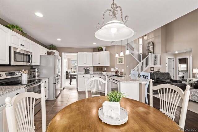20710 E Princeton Pl, Aurora, CO 80013 - dining room with stairs, recessed lighting, and light tile patterned floors