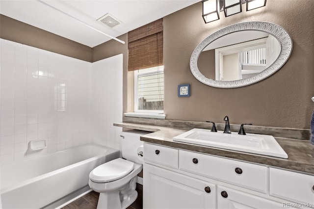 20710 E Princeton Pl, Aurora, CO 80013 - full bathroom with vanity, a textured wall, and bathtub / shower combination