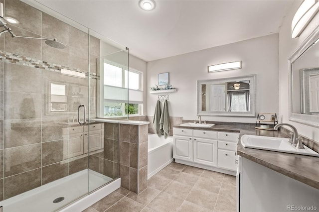 20710 E Princeton Pl, Aurora, CO 80013 - bathroom featuring vanity, a stall shower, a bath, and tile patterned flooring