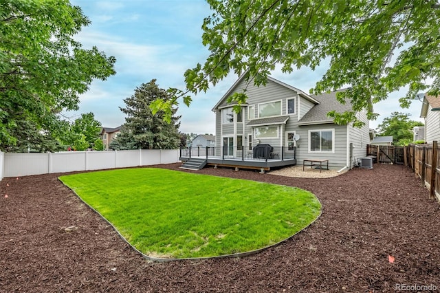 20710 E Princeton Pl, Aurora, CO 80013 - back of house featuring a fenced backyard, a deck, and a shingled roof