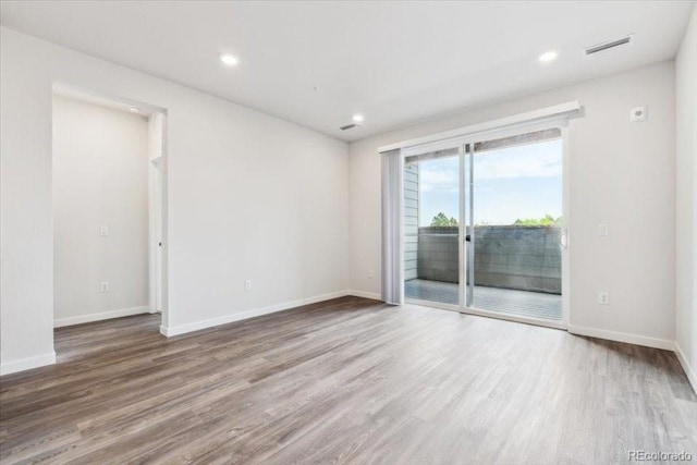 485 Interlocken Blvd Unit 201, Broomfield, CO 80021 - empty room with wood finished floors, baseboards, and recessed lighting