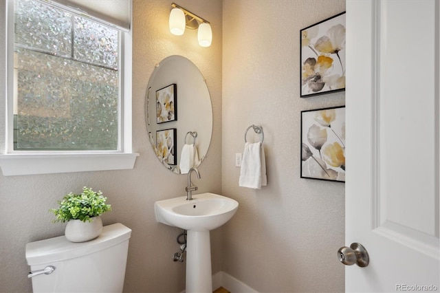 bathroom featuring toilet