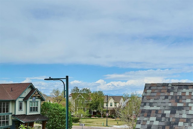 exterior space featuring street lighting and a residential view