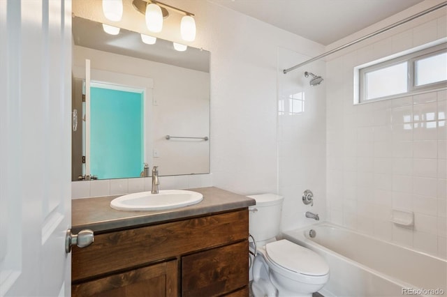 full bathroom with toilet, vanity, and shower / tub combination