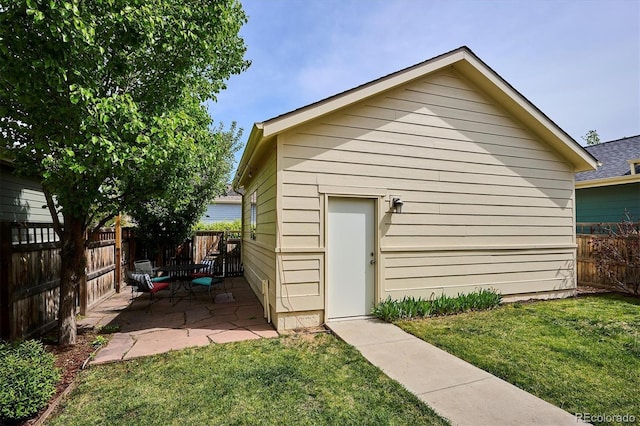 view of outdoor structure with a fenced backyard