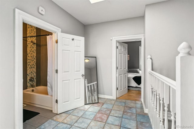 909 W Park Ave, Denver, CO 80205 - hallway featuring an upstairs landing and light stone finish floors