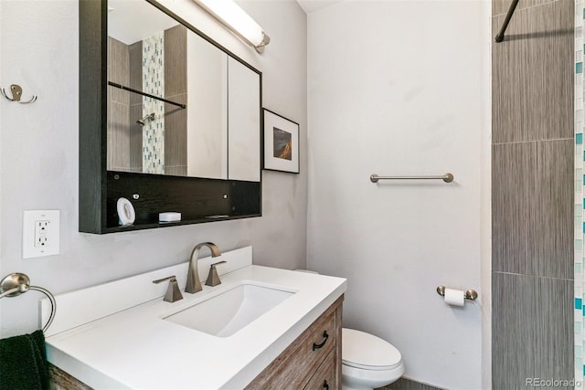909 W Park Ave, Denver, CO 80205 - bathroom with a tile shower and vanity