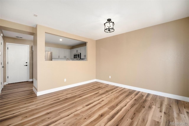 817 Pintail Ave, Brighton, CO 80601 - empty room with baseboards and light wood-type flooring