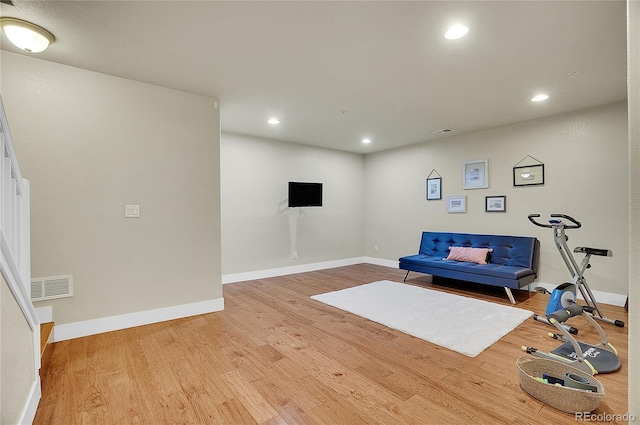 living area with light hardwood / wood-style flooring