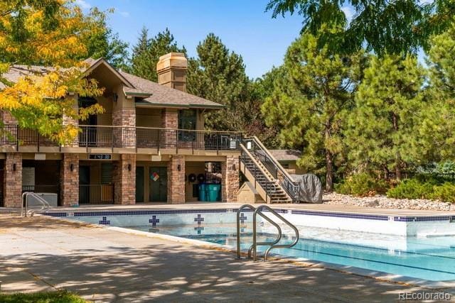 view of swimming pool with a patio area