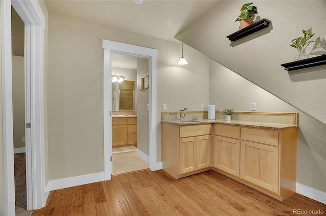 bathroom featuring vanity and hardwood / wood-style flooring