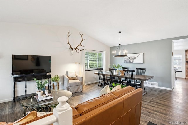 700 Prairie Ridge Rd, Highlands Ranch, CO 80126 - living room with a chandelier, vaulted ceiling, and wood finished floors