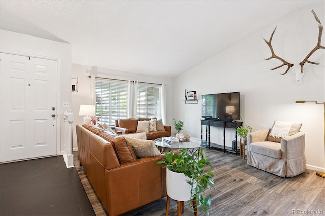 700 Prairie Ridge Rd, Highlands Ranch, CO 80126 - living room with wood finished floors and vaulted ceiling