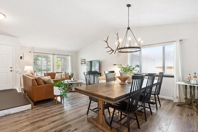 700 Prairie Ridge Rd, Highlands Ranch, CO 80126 - dining room featuring wood finished floors, a chandelier, and lofted ceiling