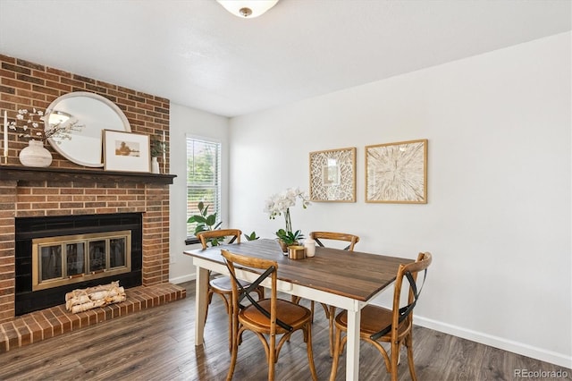 700 Prairie Ridge Rd, Highlands Ranch, CO 80126 - dining area with wood finished floors and a fireplace