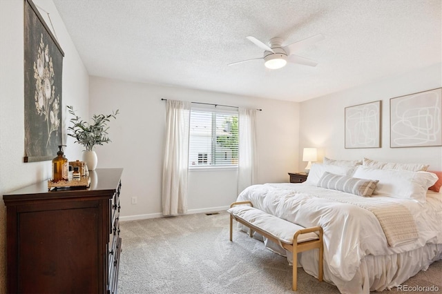 700 Prairie Ridge Rd, Highlands Ranch, CO 80126 - bedroom with light colored carpet, a textured ceiling, and ceiling fan