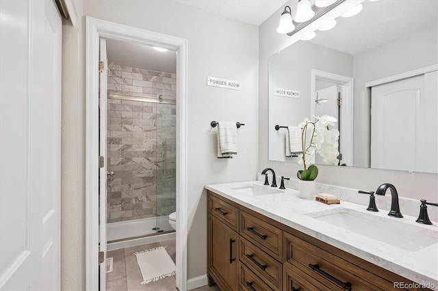 700 Prairie Ridge Rd, Highlands Ranch, CO 80126 - bathroom with double vanity, a stall shower, and tile patterned flooring