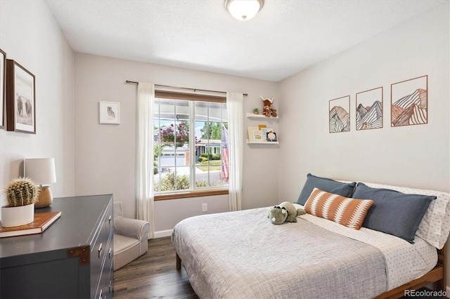 700 Prairie Ridge Rd, Highlands Ranch, CO 80126 - bedroom featuring dark wood-type flooring and baseboards