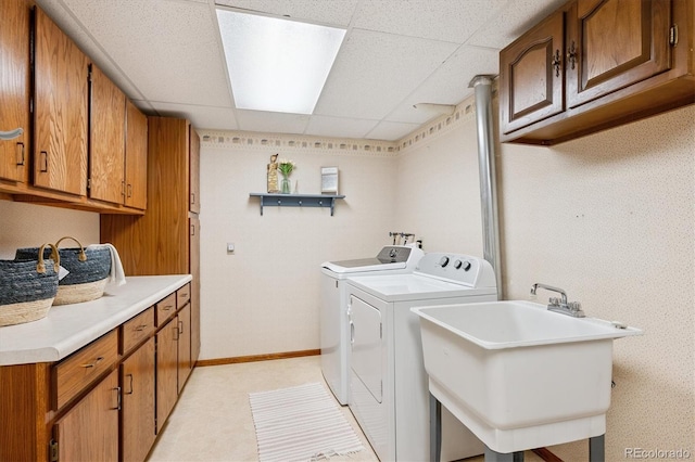 700 Prairie Ridge Rd, Highlands Ranch, CO 80126 - laundry room with washing machine and clothes dryer, cabinet space, and light floors