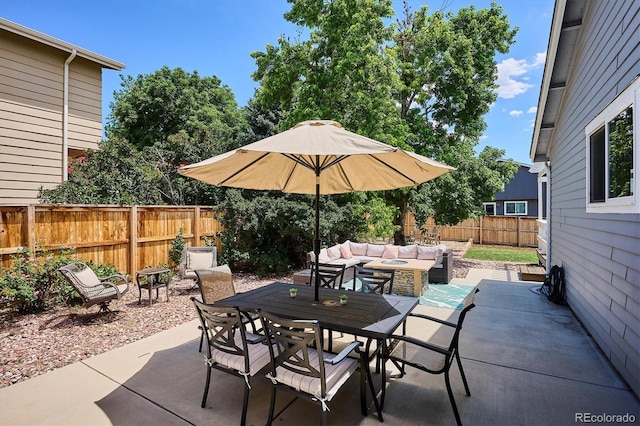 700 Prairie Ridge Rd, Highlands Ranch, CO 80126 - fenced backyard with a patio area, outdoor dining area, and an outdoor hangout area