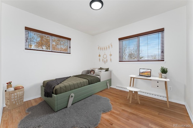 bedroom with hardwood / wood-style flooring