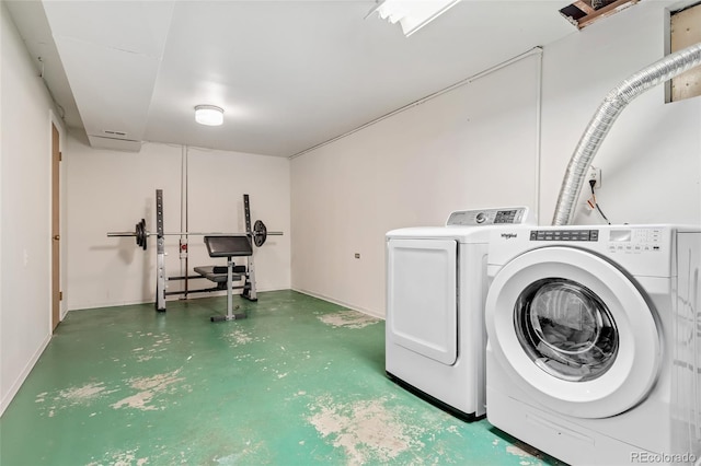 washroom with washing machine and dryer