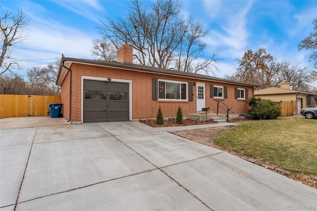 single story home featuring a garage and a front lawn