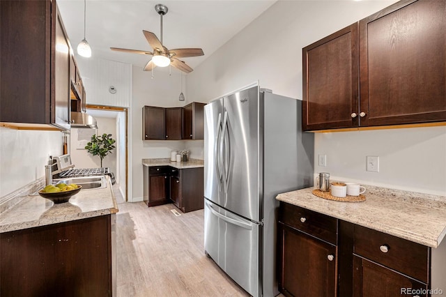 1516 Lafayette St, Denver, CO 80218 - kitchen featuring freestanding refrigerator, dark brown cabinets, a ceiling fan, light wood-style floors, and light countertops