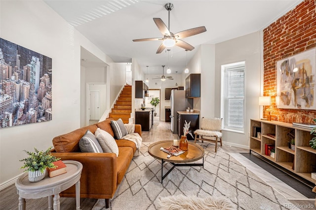 1516 Lafayette St, Denver, CO 80218 - living room featuring stairway, ceiling fan, light wood finished floors, and baseboards