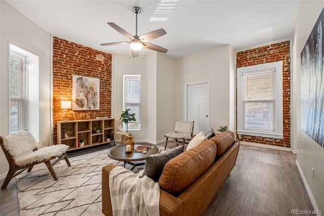 1516 Lafayette St, Denver, CO 80218 - living area with brick wall, baseboards, wood finished floors, and ceiling fan