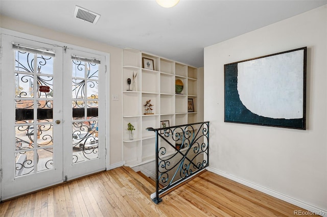 1516 Lafayette St, Denver, CO 80218 - doorway to outside with light wood-style floors, french doors, and baseboards