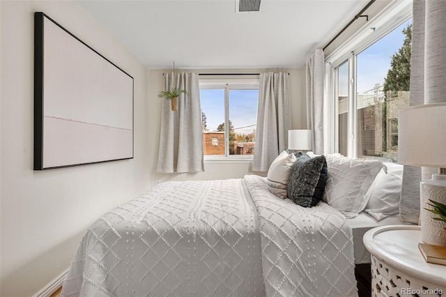 1516 Lafayette St, Denver, CO 80218 - bedroom with multiple windows and baseboards