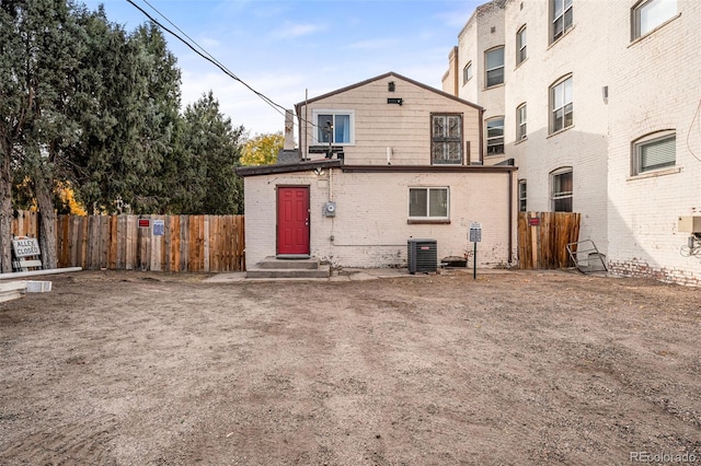 1516 Lafayette St, Denver, CO 80218 - rear view of property with brick siding, fence, and central air condition unit