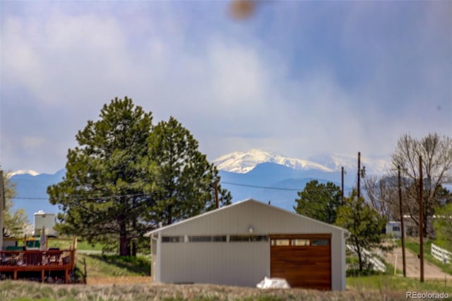 15432 Greenstone Cir, Parker, CO 80134 - view of front of property featuring a deck with mountain view, a garage, and an outdoor structure