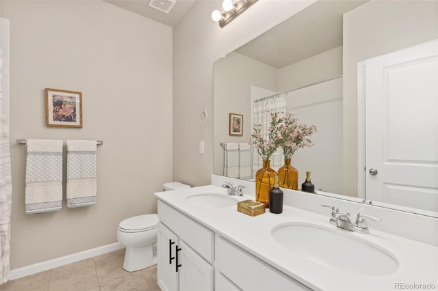 113 Marlowe Dr, Erie, CO 80516 - full bath featuring double vanity, toilet, tile patterned floors, baseboards, and curtained shower