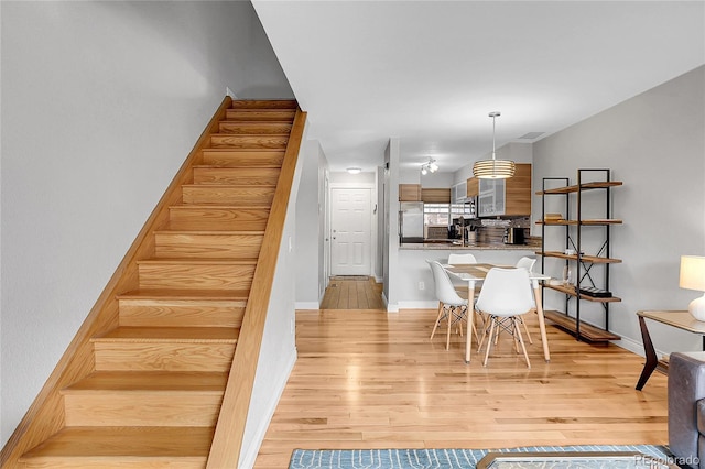 staircase with wood-type flooring