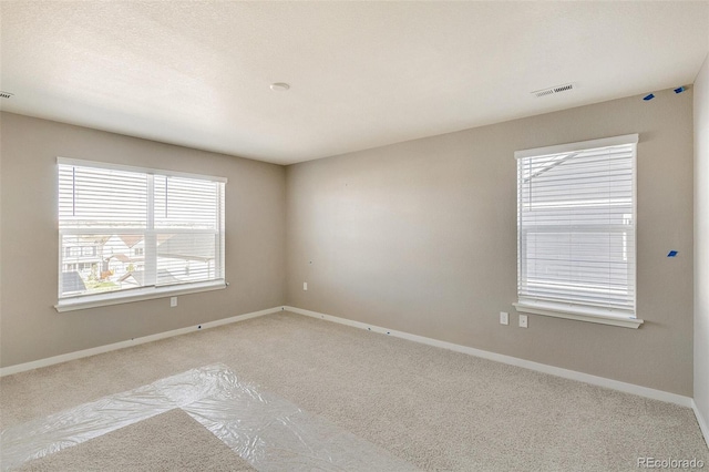 view of carpeted spare room