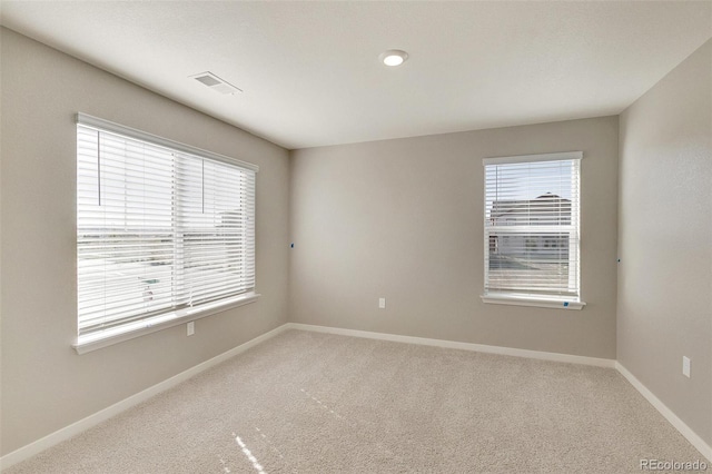 empty room featuring carpet floors