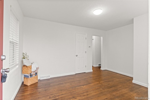 1414 W Nevada Pl, Denver, CO 80223 - unfurnished room featuring wood finished floors and baseboards