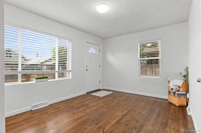1414 W Nevada Pl, Denver, CO 80223 - foyer entrance with baseboards and dark wood-style flooring
