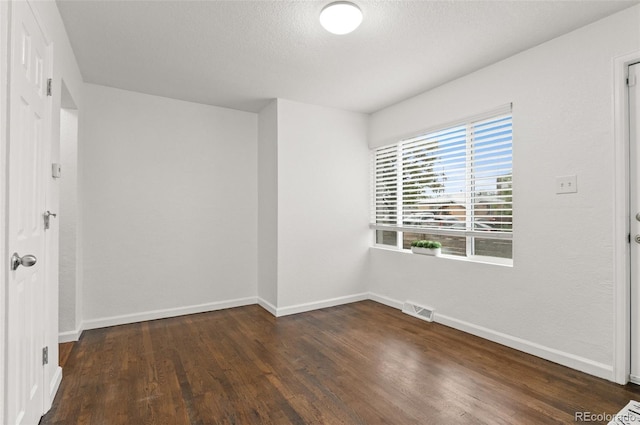 1414 W Nevada Pl, Denver, CO 80223 - unfurnished room featuring dark wood-style floors and baseboards
