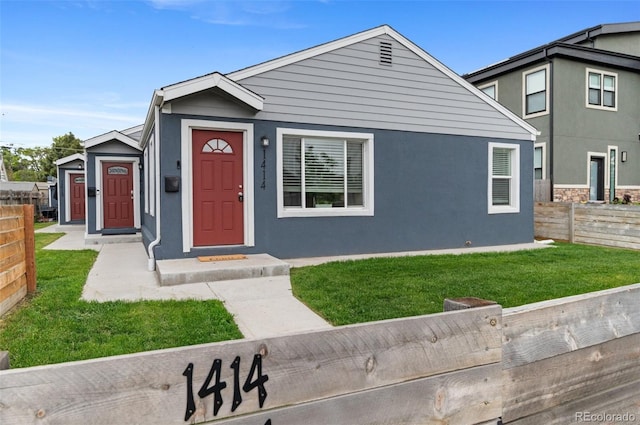 1414 W Nevada Pl, Denver, CO 80223 - view of front of home featuring stucco siding